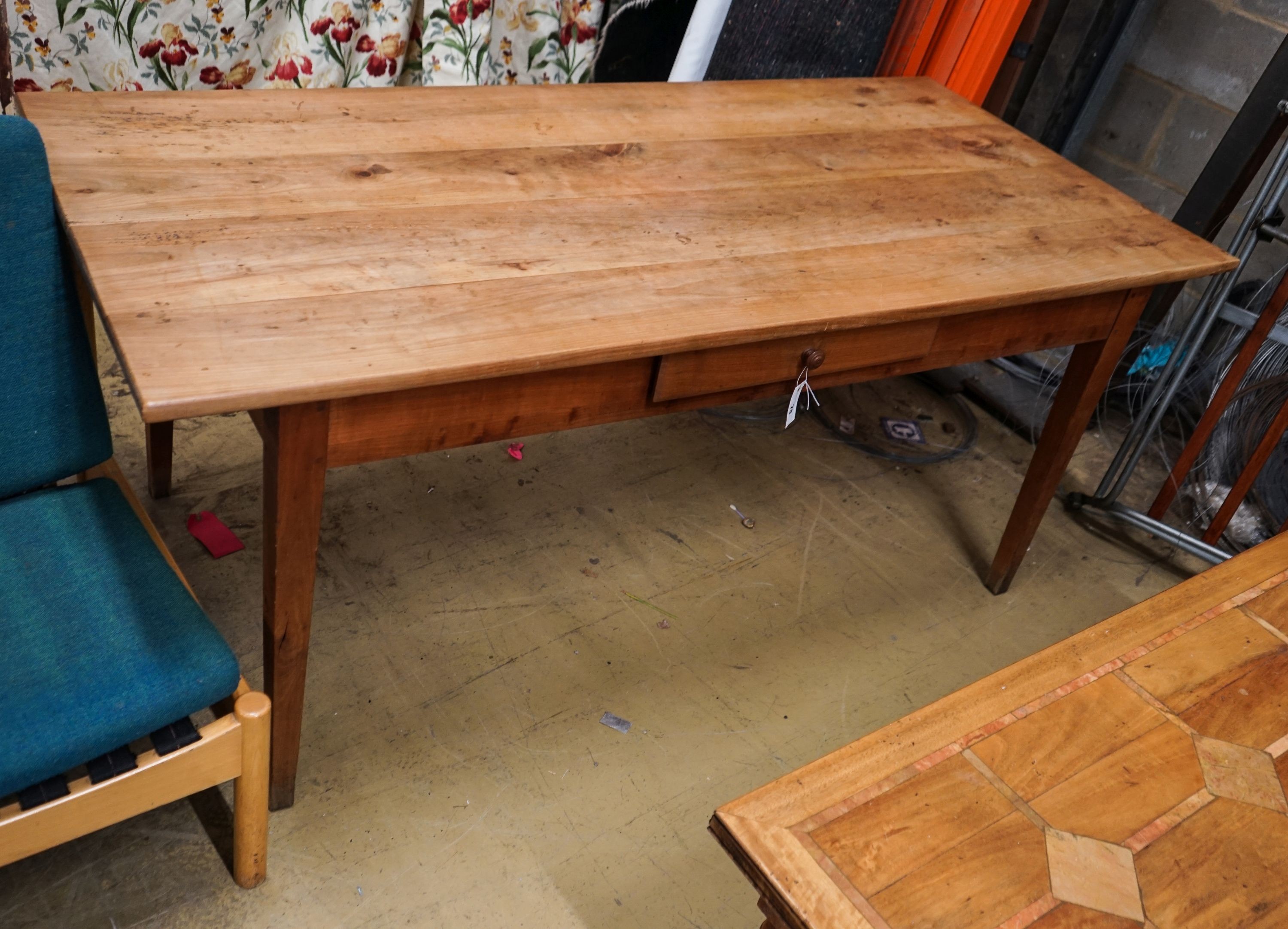 An early 19th century French cherry farmhouse table, fitted drawer, length 180cm, depth 82cm, height 76cm